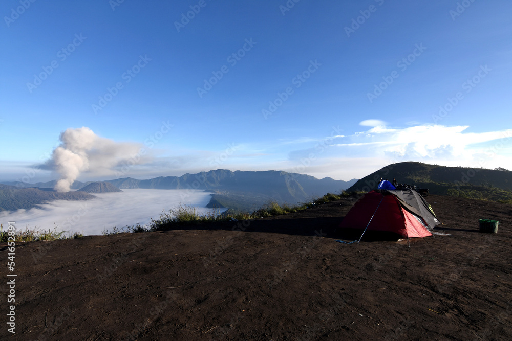 A clear morning view at the foot of Mount Semeru, East Java, Indonesia with the view below showing Mount Bromo covered in thick clouds