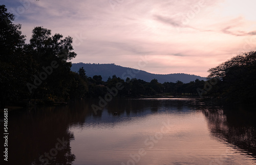 beautiful pastel cloudy sky with long river and big mountains