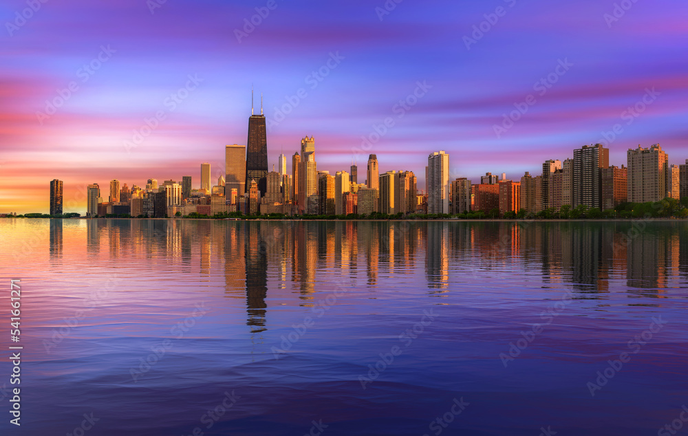 Colorful sunset above Chicago skyline across Lake Michigan