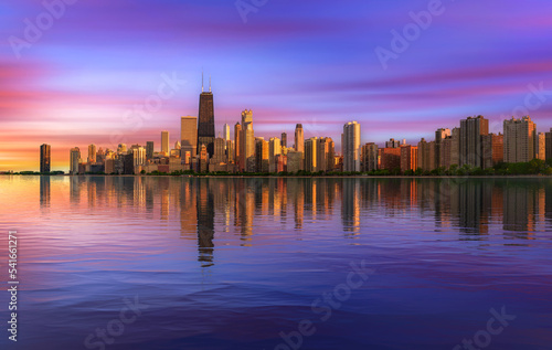 Colorful sunset above Chicago skyline across Lake Michigan