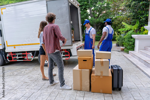 Professional goods move service use truck carry personal belongings door to door transport delivery handover boxes luggage one by one and keep stack on the floor before transfer to place in house