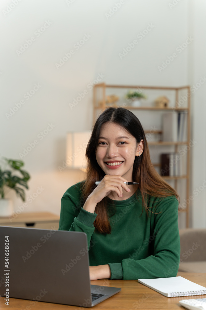 Asian girl with laptop computer on desk. Asian girl with laptop computer on desk.