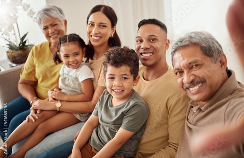 Family, selfie and happy portrait of children, parents and grandparents with love, happiness and support for social media picture. Men, women and kids together to smile for home sofa memory portrait © Beaunitta V W/peopleimages.com