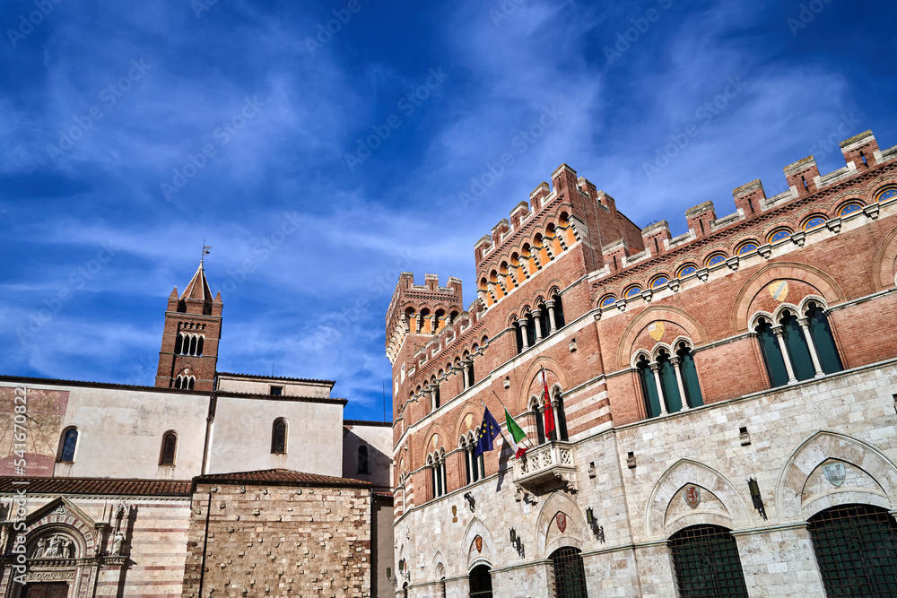 Belfry of historic cathedral and Towers of a renaissance castle in the city of Grosseto