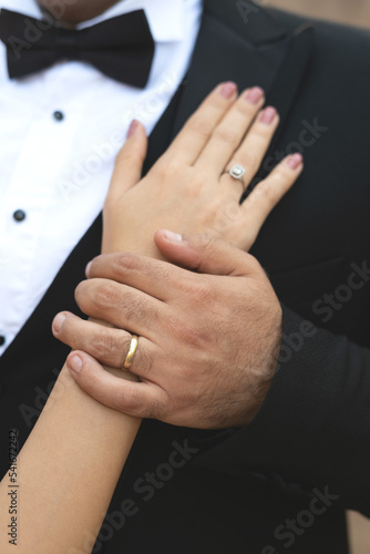 Close-up of wedding couple with wedding rings holding hands,wedding couple