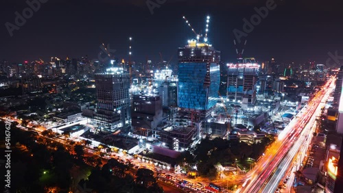 Wallpaper Mural Time-lapse of construction site at night, car traffic transportation on road in Asia city, high angle view. Advanced building technology, busy downtown cityscape, developing industrial country concept Torontodigital.ca