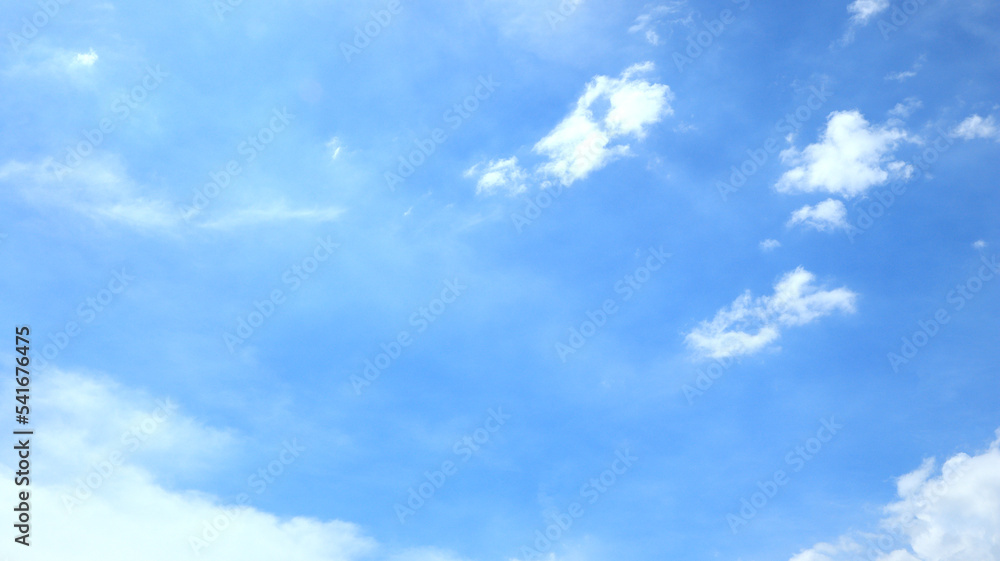 Fototapeta premium Clear blue sky and white clouds. Beautiful white cloud on clear blue sky as nature concept . Clear weather for good summer season. Fresh air breeze. Timelapse motion.