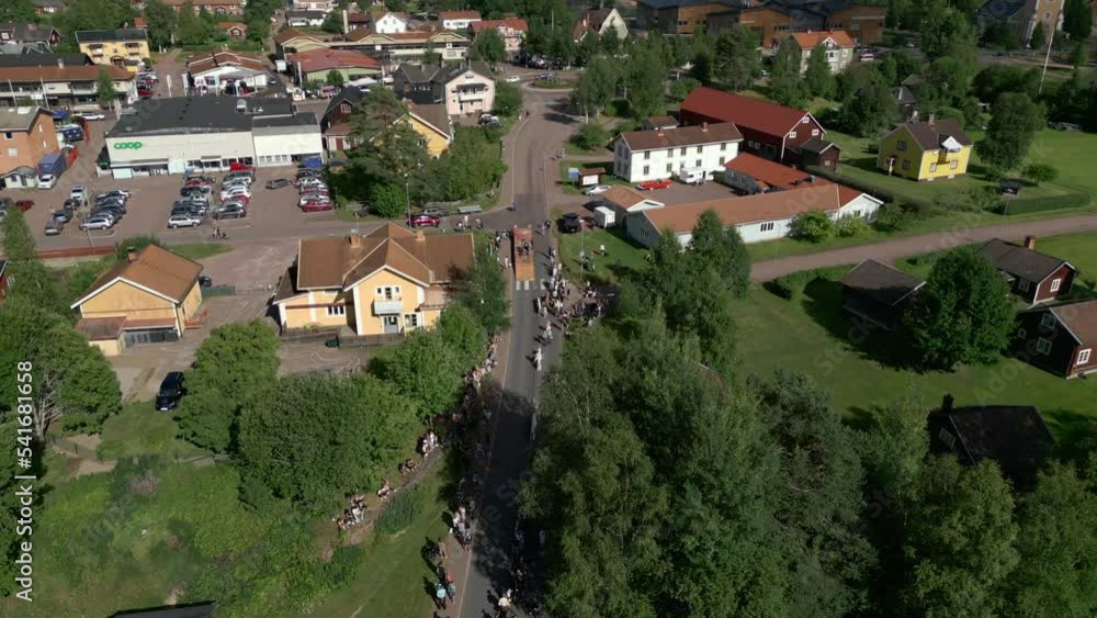 Box car race with spectators watching from each side of the road. Orbiting aerial footage. Box car race with spectators watching from each side of the road. Orbiting aerial footage.