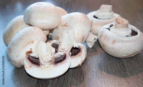 Champignons close-up on the table. The concept of farming, growing mushrooms for sale