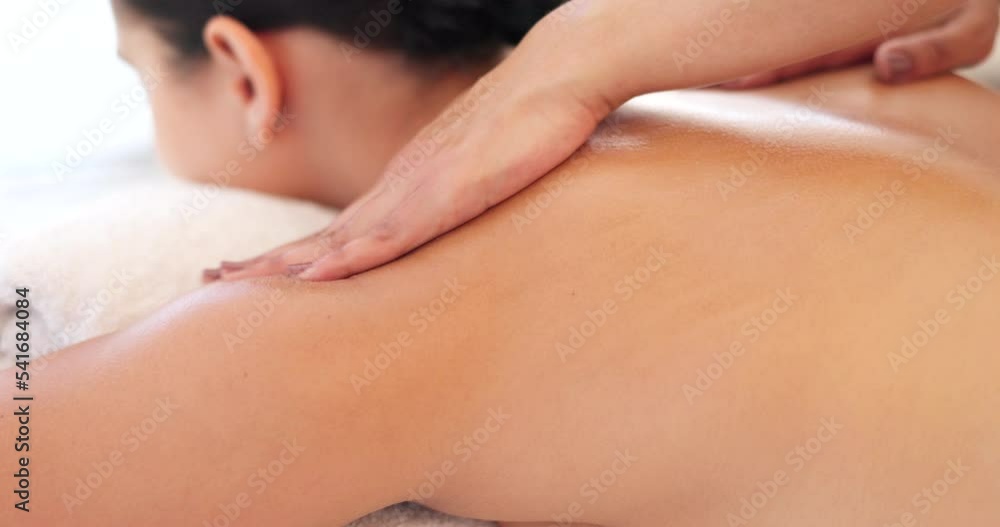 Relax, hand and therapist massage woman at luxury health and wellness spa for skincare and body treatment. Customer, physical therapy and hands on back for calm, stress relief and muscle tension Relax, hand and therapist massage woman at luxury health and wellness spa for skincare and body treatment. Customer, physical therapy and hands on back for calm, stress relief and muscle tension