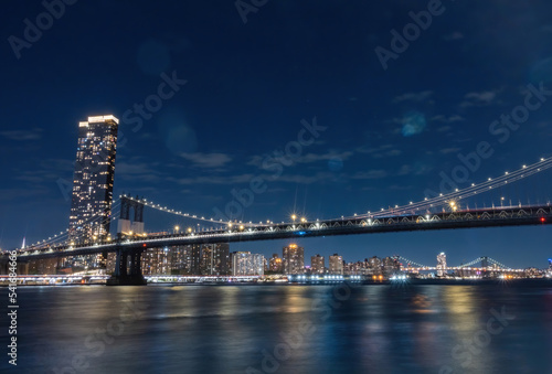 View of New York City - beautiful landscape  Manhattan Bridge  waterfront at night over bridge