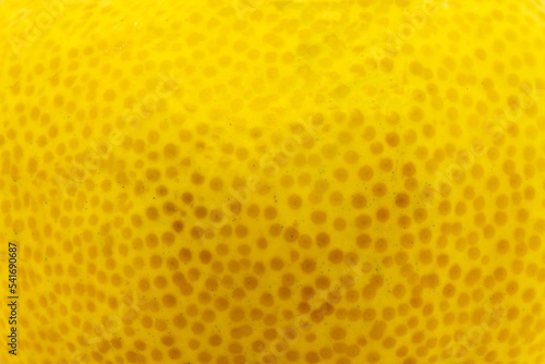 Yellow citrus fruit peel close-up texture background
