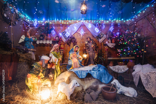 Christmas crib at a Cologne Christmas market. The scene where the Virgin Mary gave birth to Jesus and he lies in the cradle surrounded by people who have come to celebrate the Nativity of Christ