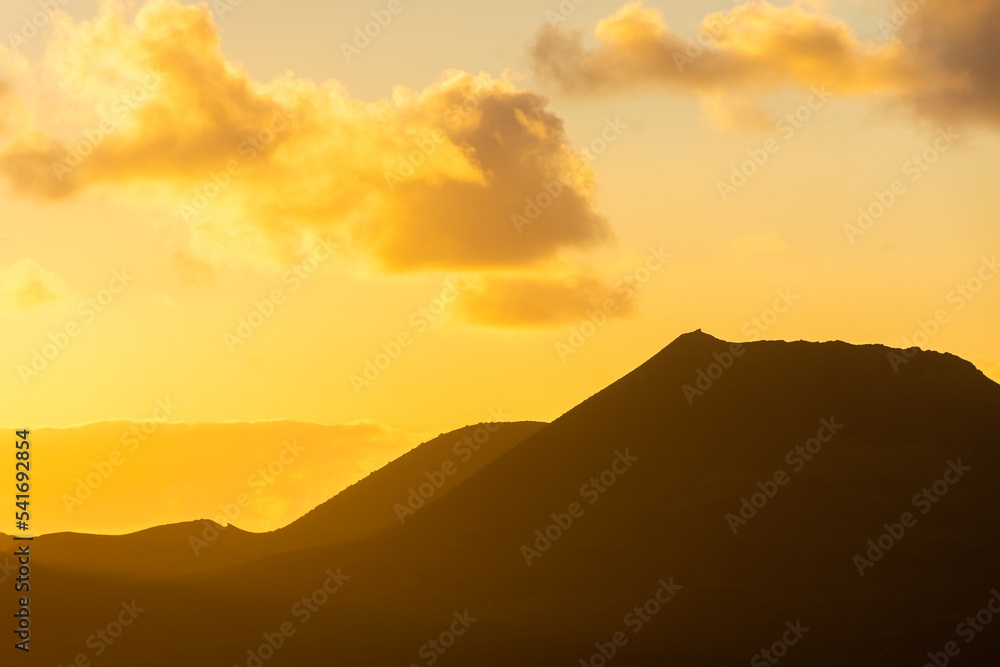Beautiful silhouette of Lanzarote volcanos at sunset, Canary Islands,  Spain