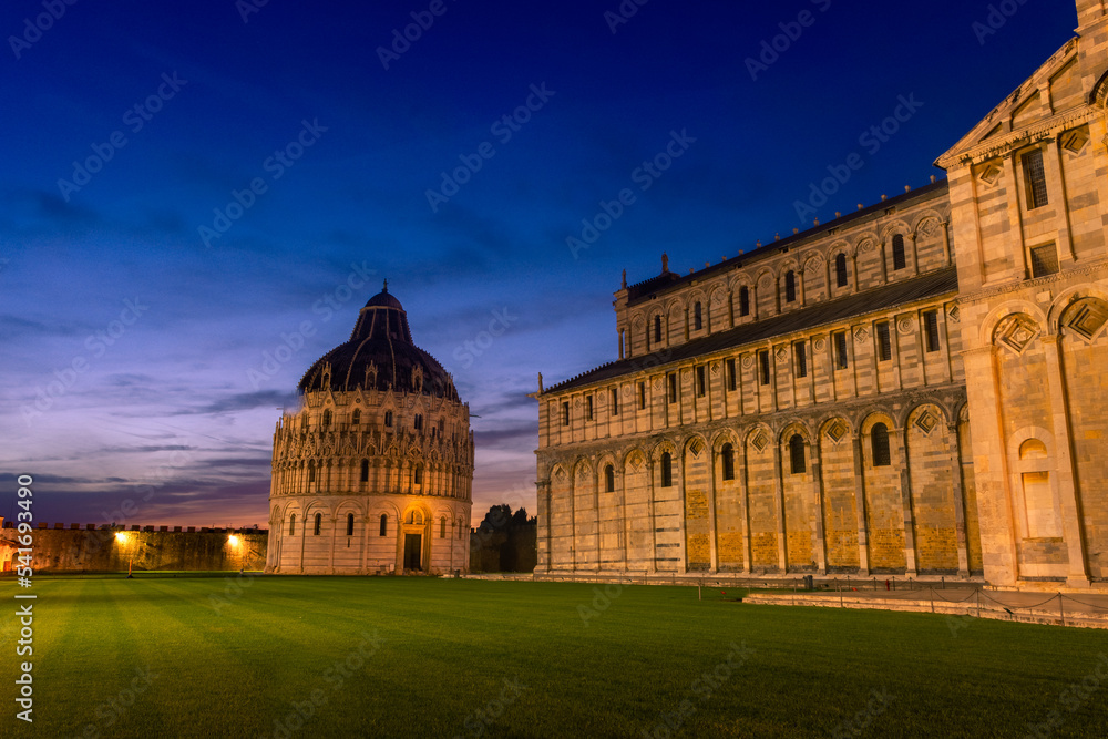 Beautiful night view of Campo dei Miracoli square with the Baptistery and the Cathedral of Pisa,  Italy
