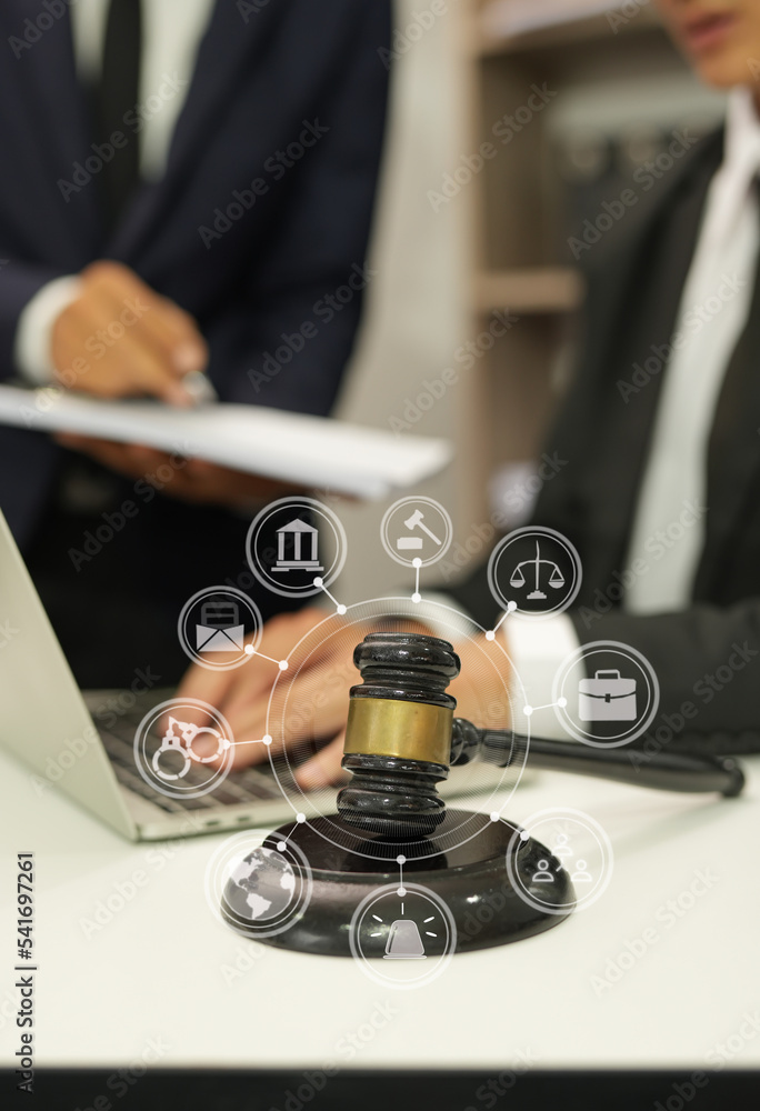 judge on wooden table And experienced lawyers meet with clients and give advice behind the scenes. legal services legal consulting concept judge on wooden table And experienced lawyers meet with clients and give advice behind the scenes. legal services legal consulting concept