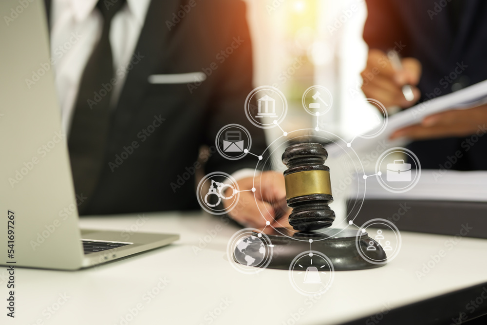 judge on wooden table And experienced lawyers meet with clients and give advice behind the scenes. legal services legal consulting concept judge on wooden table And experienced lawyers meet with clients and give advice behind the scenes. legal services legal consulting concept
