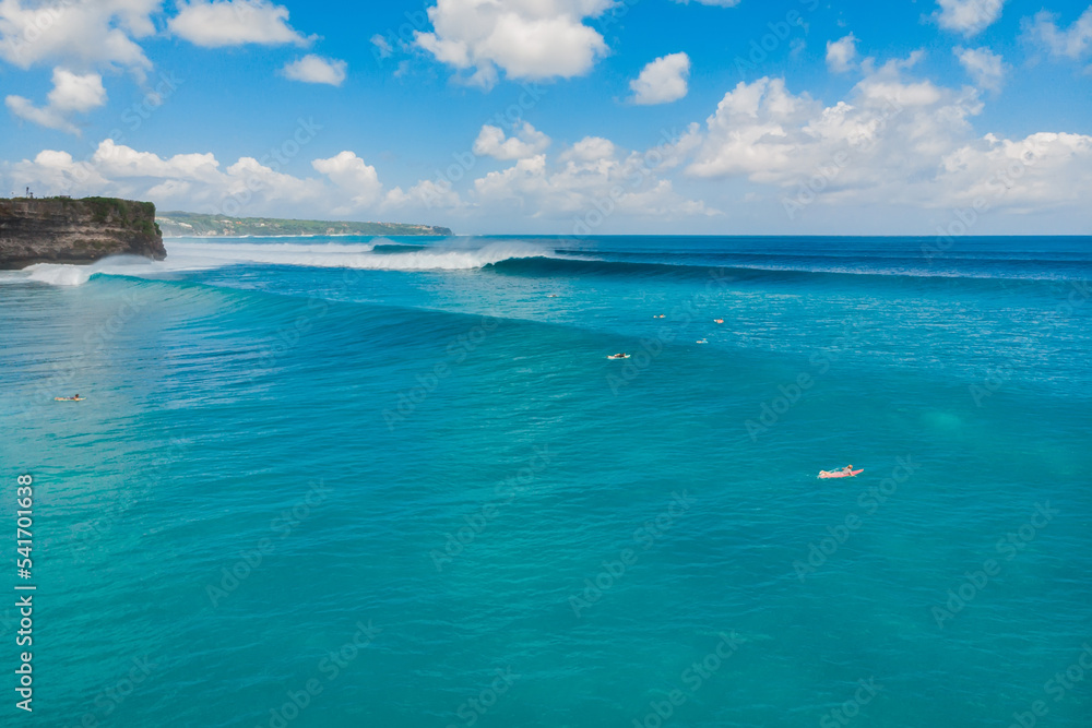 Aerial view of big waves and surfing in Bali