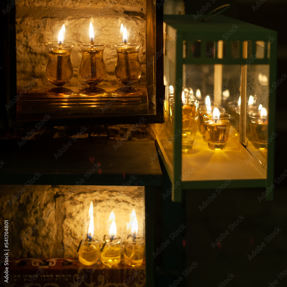 Oil lights from multiple Hanukkah menorahs in Israel, where it is