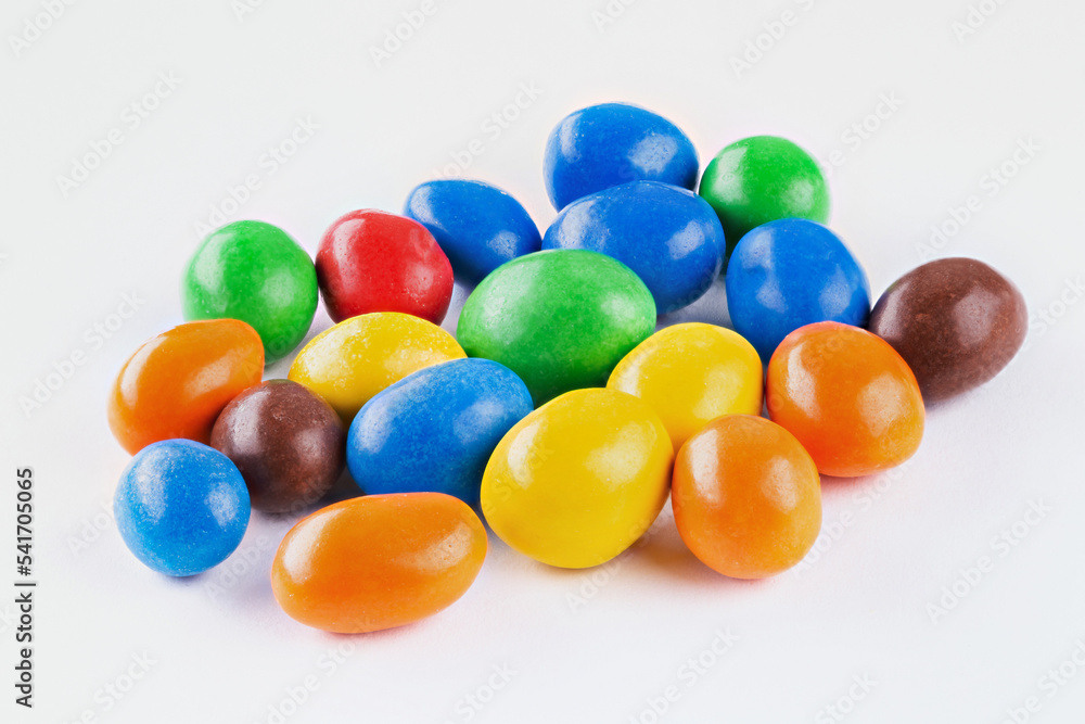 Chocolate coated Peanuts. Colorful chocolate buttons, on white background. Chocolate coated Peanuts. Colorful chocolate buttons, on white background.