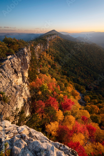 A Fall evening looking across North Fork Mountain with the Autumn foliage glowing in the setting sunlight.
