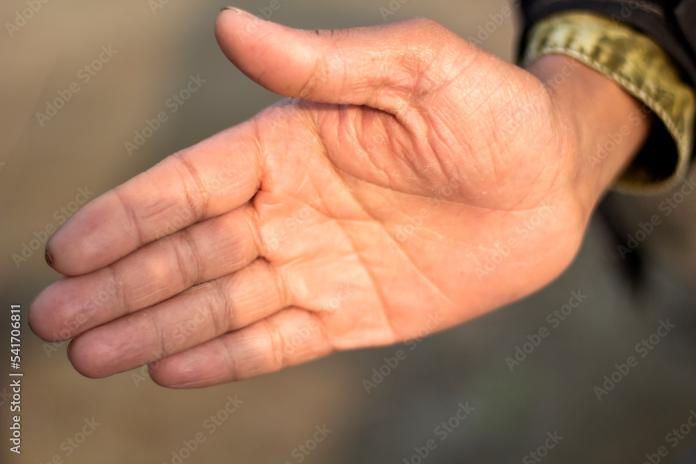 Five fingers are pressed together in one hand and the background blur Five fingers are pressed together in one hand and the background blur
