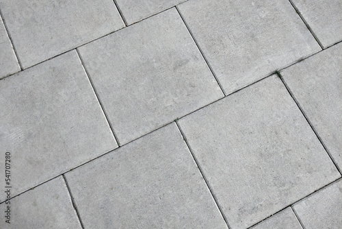 View of the gray pedestrian tiles in the city.