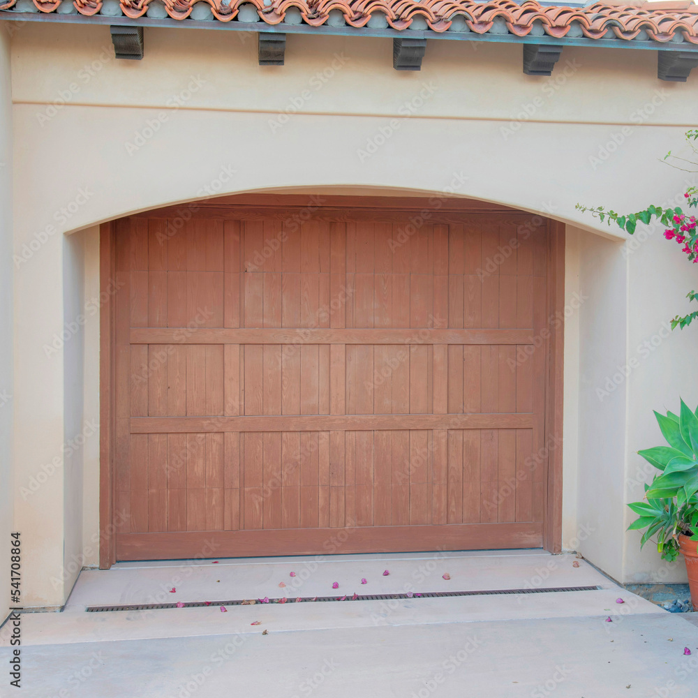 Square Garage exterior with wooden door and arched entrance at La Jolla, California