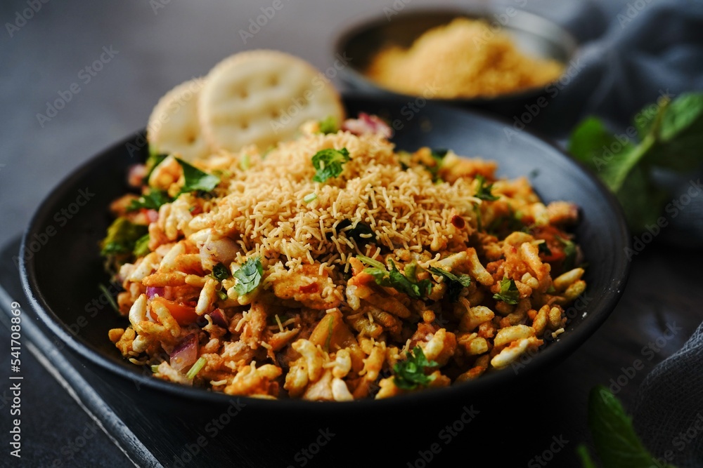 Mumbai Bhelpuri - Popular Indian street food chaat withpuffed rice, selective focus Mumbai Bhelpuri - Popular Indian street food chaat withpuffed rice, selective focus