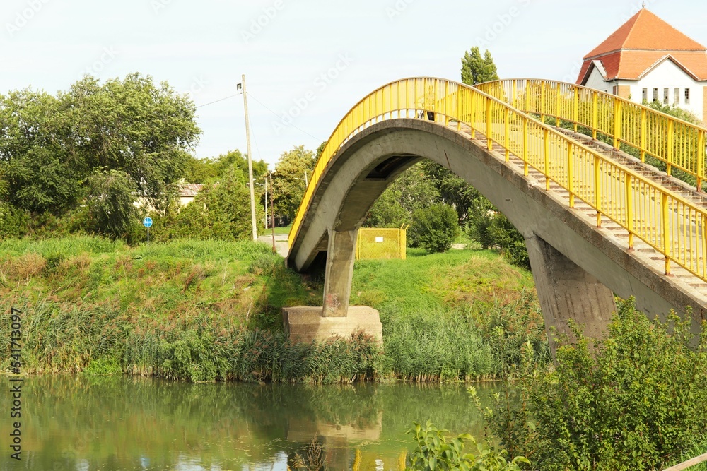 Fototapeta premium Concrete bridge for pedestrians and cyclists across the river