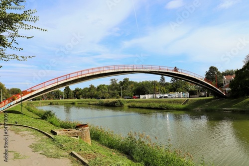 Concrete bridge for pedestrians and cyclists across the river © Ruslan