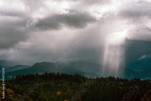Dramatic landscape, sunbeams breaking through the clouds
