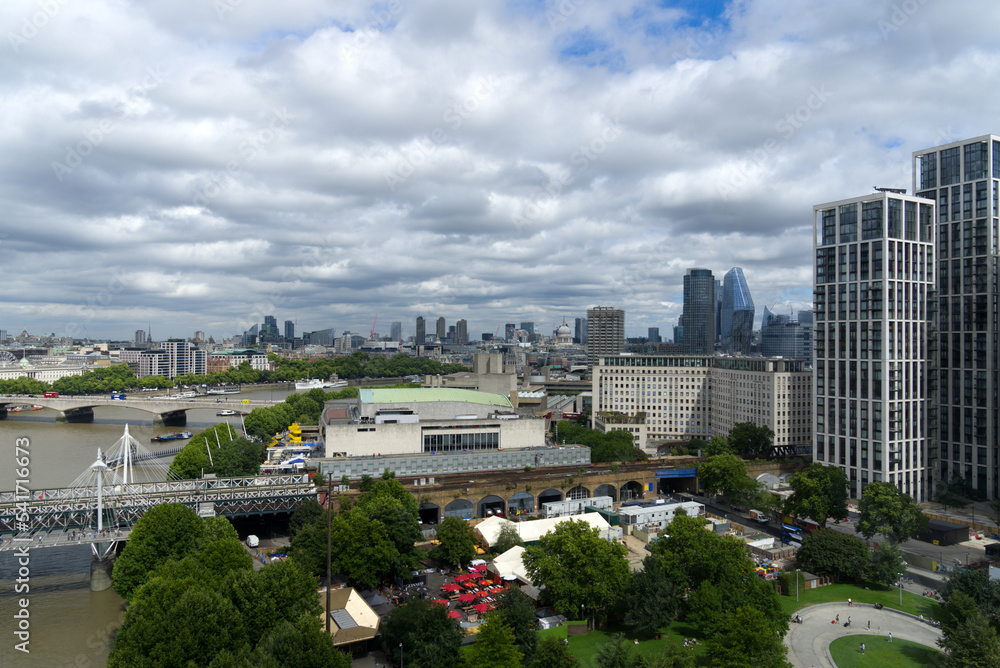 Obraz premium Aerial view of Hungerford Railway Bridge and Golden Jubilee Bridges at City of Westminster on a cloudy summer day. Photo taken August 3rd, 2022, London, United Kingdom.