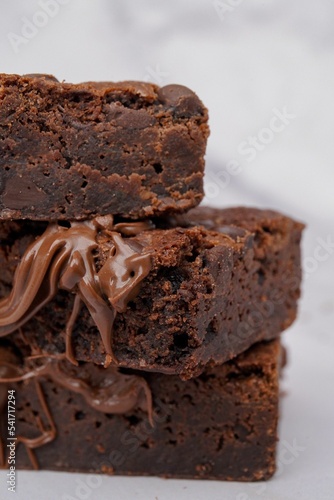 Slices of chocolate brownies on each other, close-up