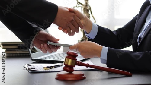 Wallpaper Mural Business people shaking hands and bribe to an attorney to help a lawyer win a court case. The concept of bribing lawyers and paying lawsuits. Torontodigital.ca