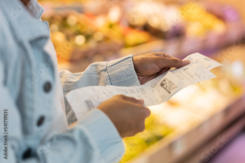 Vászonkép inflation effect, women customer checking product bills after shopping and price
