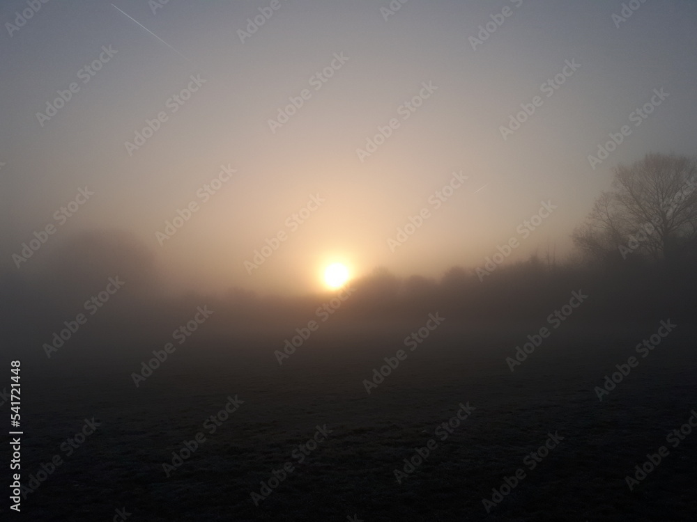 Sunrise On A Cold Misty Winters Morning