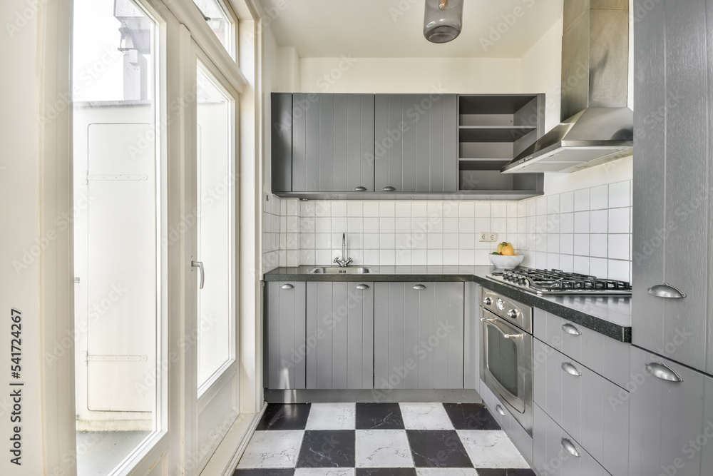 Interior of modern gray kitchen with appliances Interior of modern gray kitchen with appliances