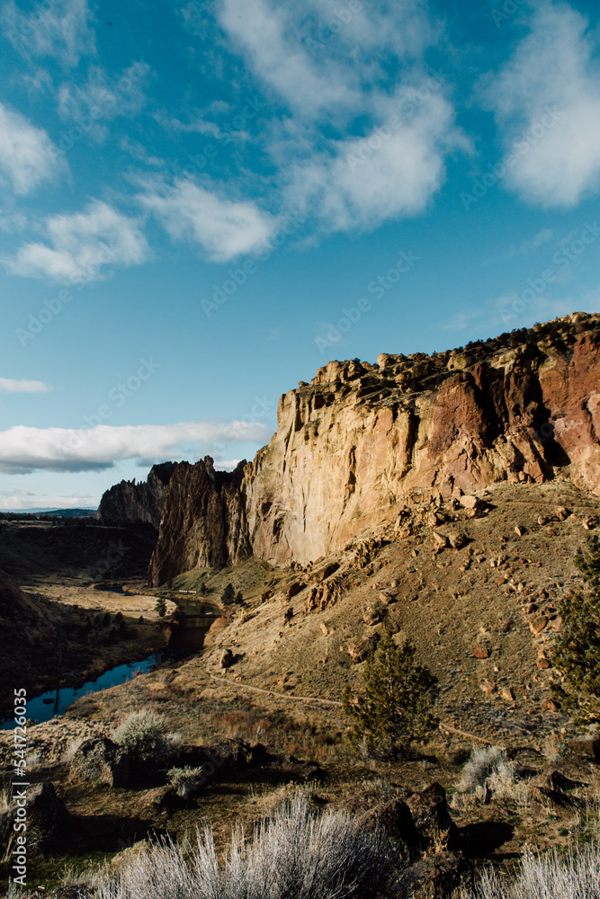 Sun hitting cliff in Oregon, rock climbing and travel bloggers enjoy this iconic desert trail spot