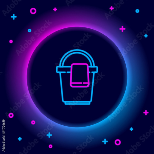 Glowing neon line Bucket with rag icon isolated on black background. Cleaning service concept. Colorful outline concept. Vector