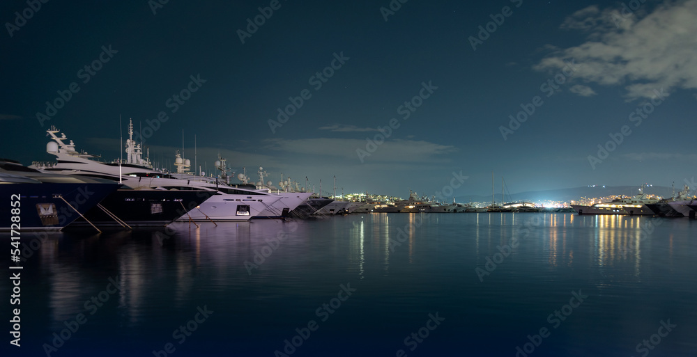 many ships at night on the pier in the Aegean Sea Athens Greece
