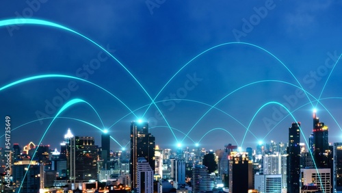 Smart digital city with connection network reciprocity over the cityscape . Concept of future smart wireless digital city and social media networking systems that connects people within the city . photo