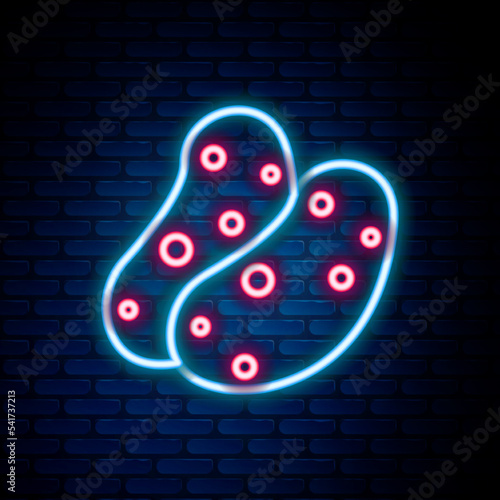 Glowing neon line Potato icon isolated on brick wall background. Colorful outline concept. Vector