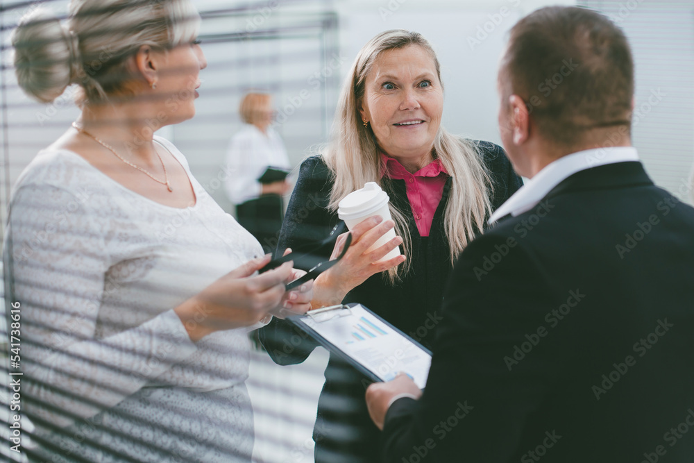 close up. group of employees discussing working issues