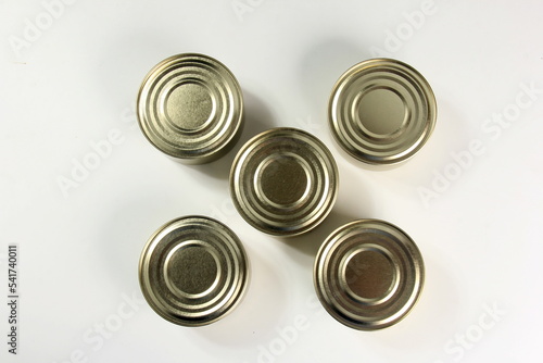 Many closed tin cans on white background. metal cans for fish and meat products