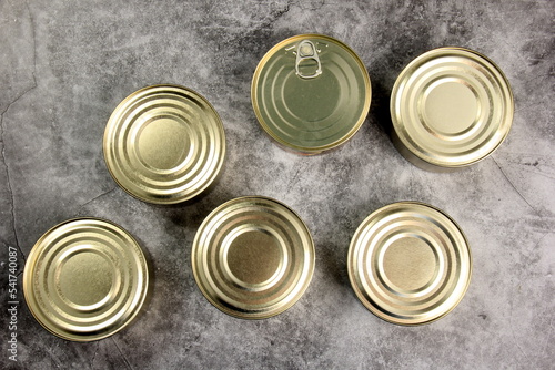 Tin cans on grey background, metal cans for fish and meat products