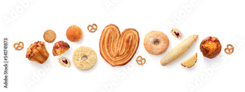 Creative layout made of breads, sweets, donuts, muffins and buns on the white background. Flat lay. Food concept. Pastry on the white.