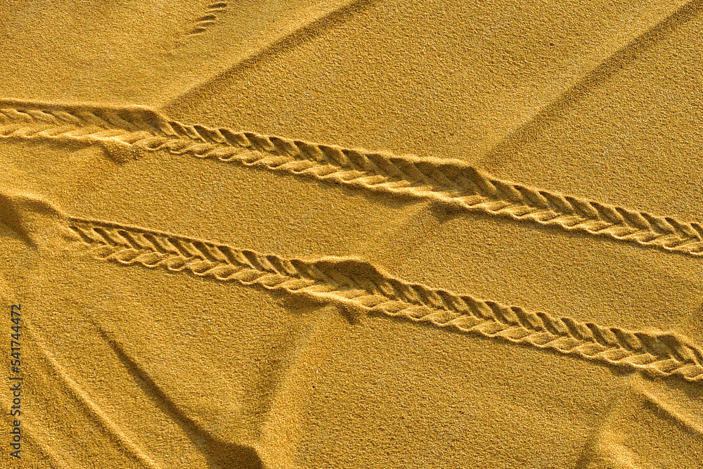 tire tracks on wheat laid to dry, tire tracks in the sand tire tracks on wheat laid to dry, tire tracks in the sand