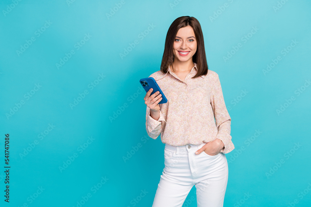 Photo of positive cute lady stylish shirt empty space like new telephone gadget rejoice buy low price isolated on cyan color background Photo of positive cute lady stylish shirt empty space like new telephone gadget rejoice buy low price isolated on cyan color background