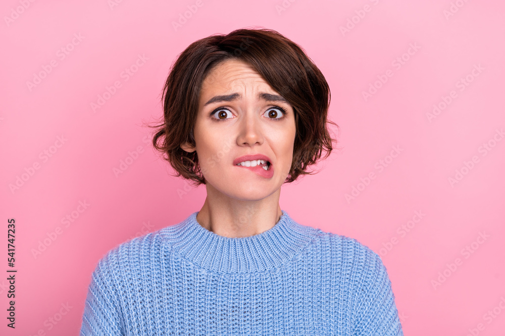 Fototapeta premium Portrait of terrified depressed displeased woman bite lips failed have big problem isolated on pink color background